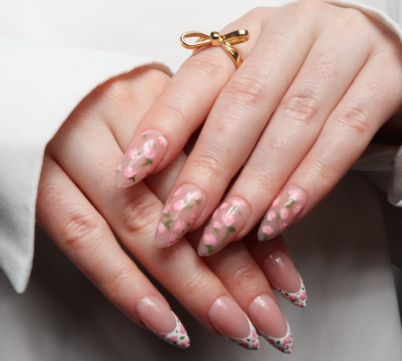 Floral Reusable nail extensions in long almond length. 