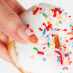 Reusable nail extensions doughnuts 3D art in long almond length.