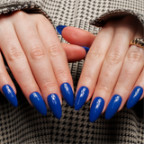 Blue solid color Reusable nail extensions in long almond length. 