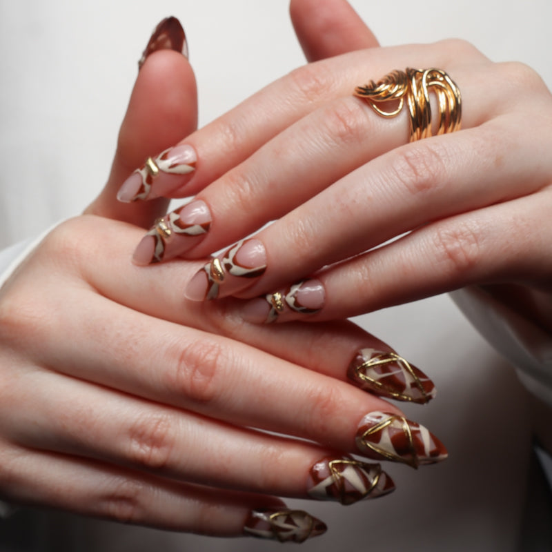 Reusable nail extensions abstract art in long round length.