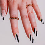 Reusable nail extensions abstract art in long almond length.