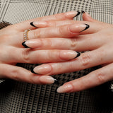 Reusable nail extensions in long almond length French nails. 