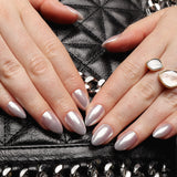 Reusable nail extensions in short almond length chrome nails. 