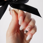 Reusable nail extensions cakepops 3D art in long almond length.