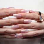 Reusable nail extensions in long almond length chrome nails. 