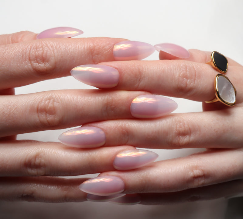 Reusable nail extensions in long almond length chrome nails. 