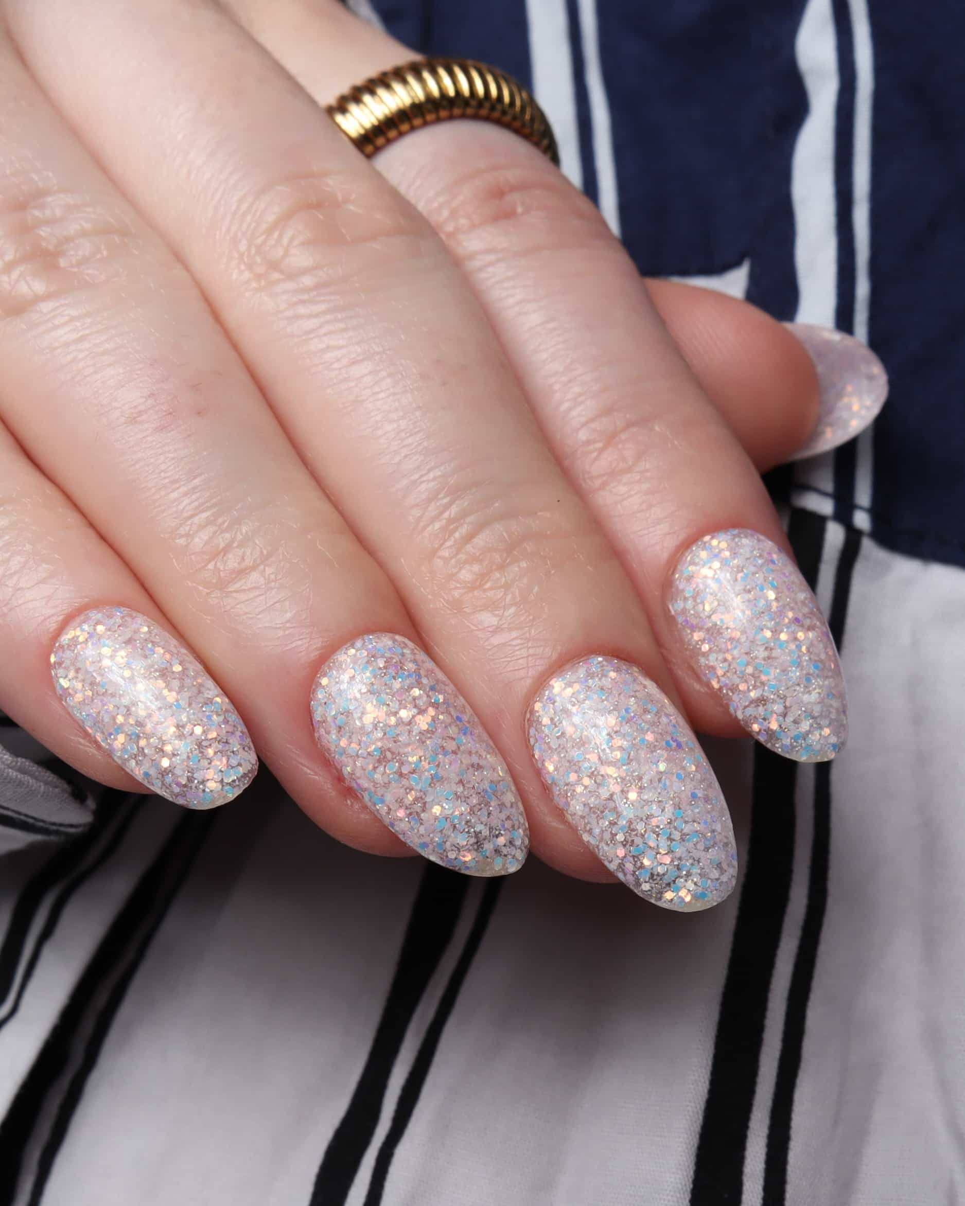 Glitter nails. Encapsulated glitter. Reusable nail extensions. 