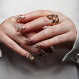 Reusable nail extensions abstract art in long round length.