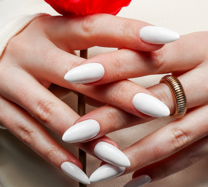 White solid color Reusable nail extensions in long almond length. 