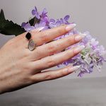 Reusable nail extensions in long almond length French nails. 