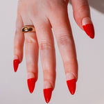 Reusable nail extensions red abstract French in long almond length.