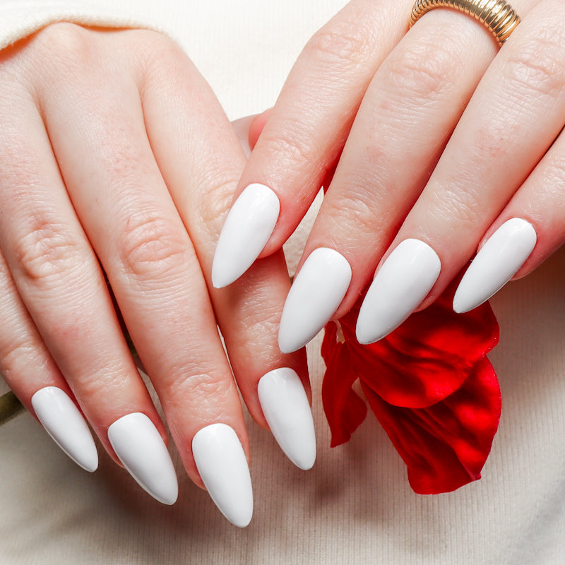 White solid color Reusable nail extensions in long almond length. 