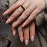 Reusable nail extensions in short almond length chrome nails. 