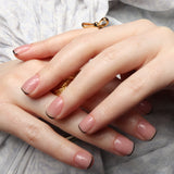 Reusable nail extensions in short square length micro French nails. 