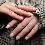 Reusable nail extensions in short square length micro French nails. 