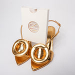 Reusable toenails extensions in box with gold heels. Hard builder gel toenails. 