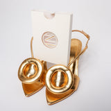 Reusable toenails extensions in box with gold heels. Hard builder gel toenails. 