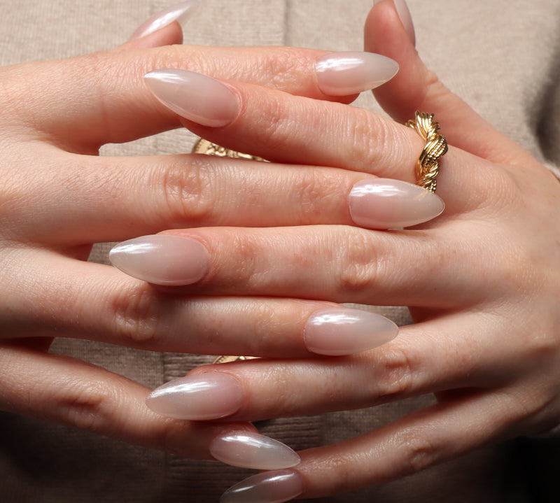 Reusable nail extensions in long almond length chrome nails. 