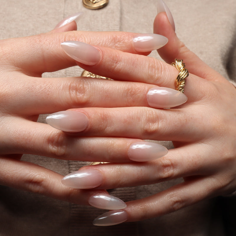 Reusable nail extensions in long almond length chrome nails. 