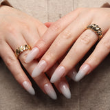 Reusable nail extensions clean manicure in long almond length.