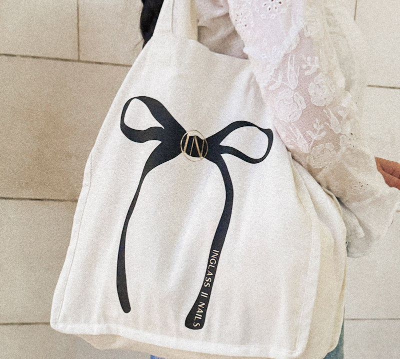 Canvas tote cotton with black and gold bow. 