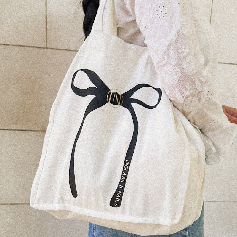 Canvas tote cotton with black and gold bow. 