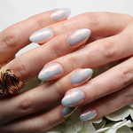 Reusable nail extensions in short almond length chrome nails. 