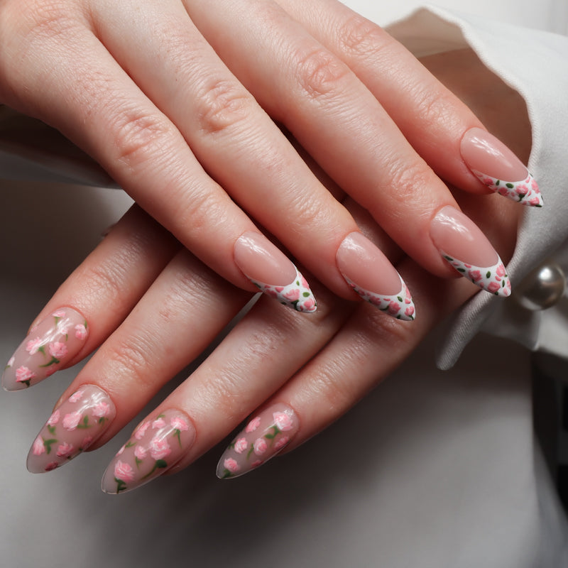 Floral Reusable nail extensions in long almond length. 