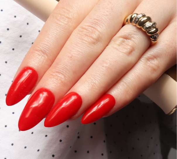 Red solid color Reusable nail extensions in long almond length. 