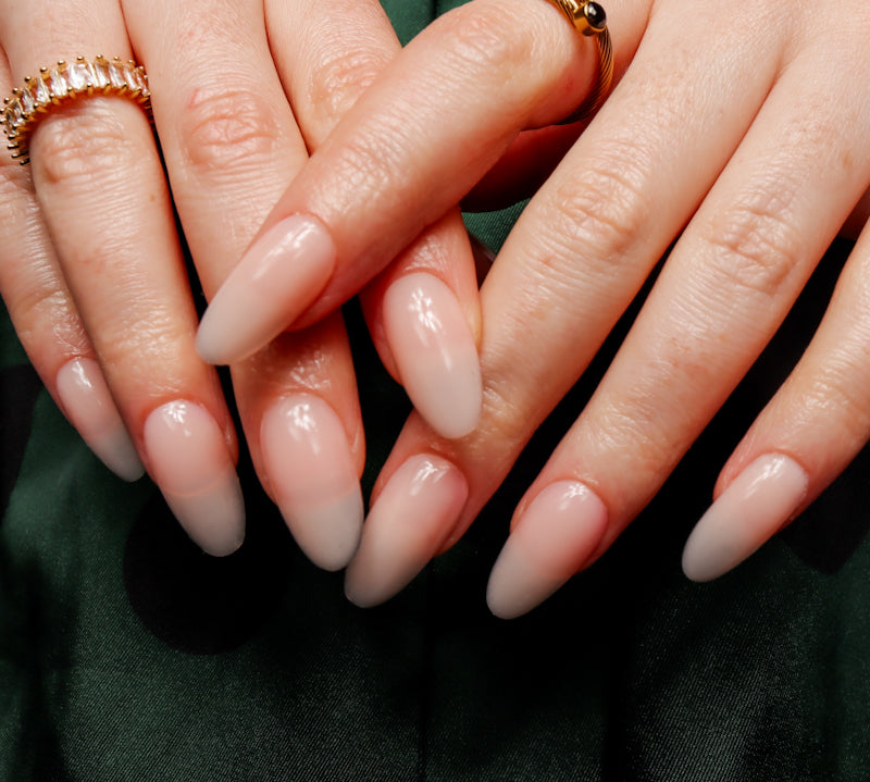 Reusable nail extensions in long almond length.