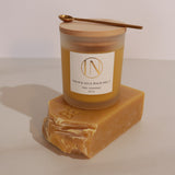 Palm and sole balm melt with a wooden container on a beige background