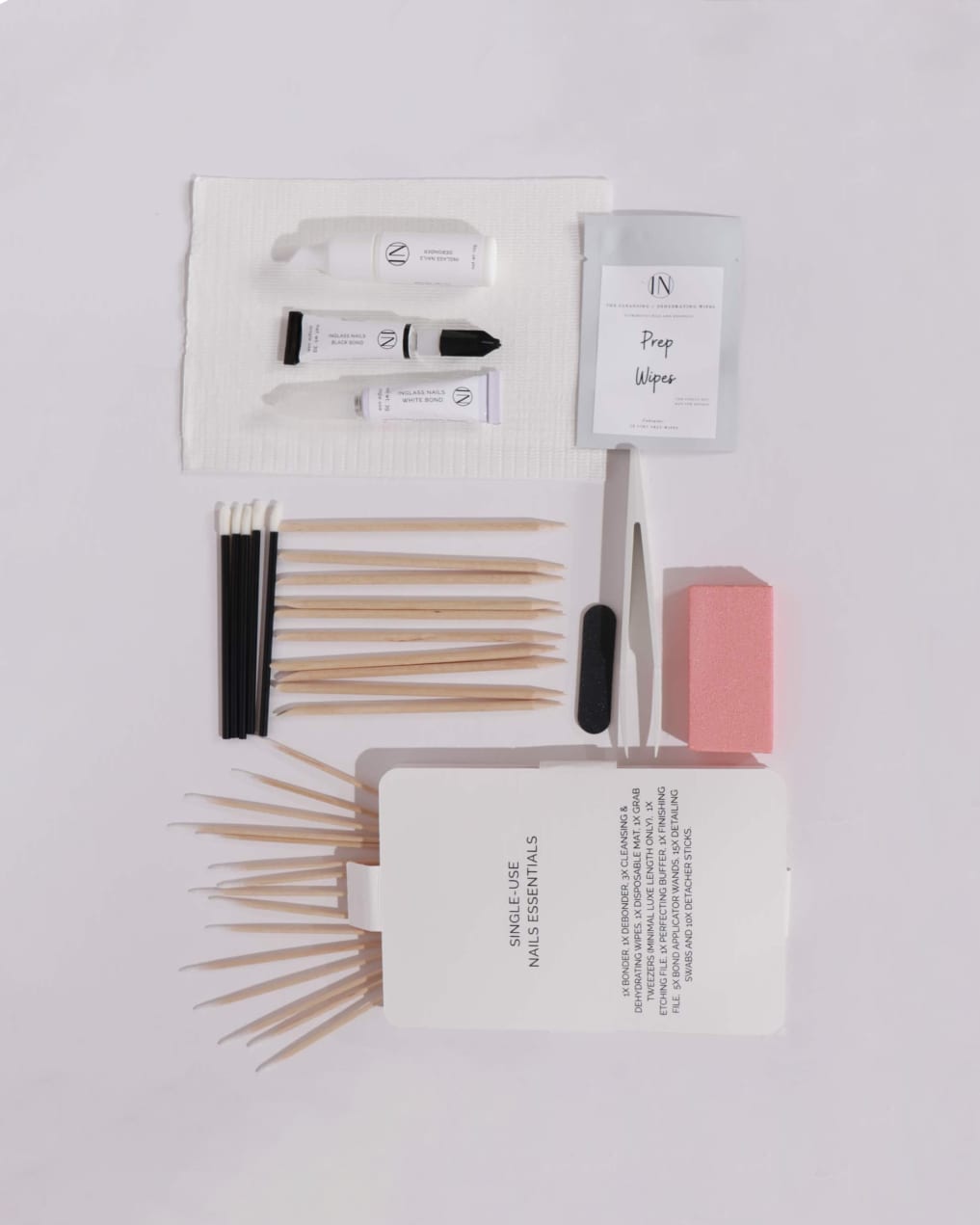 Set of nail care tools including files, cuticle sticks, and bonder and debonder by inglass nails