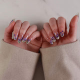 purple flowers nail extensions on hand