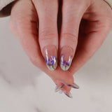 purple flowers nail extensions on hand