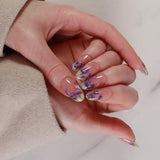 purple flowers nail extensions on hand