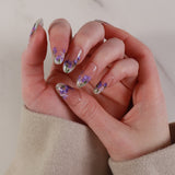 purple flowers nail extensions on hand