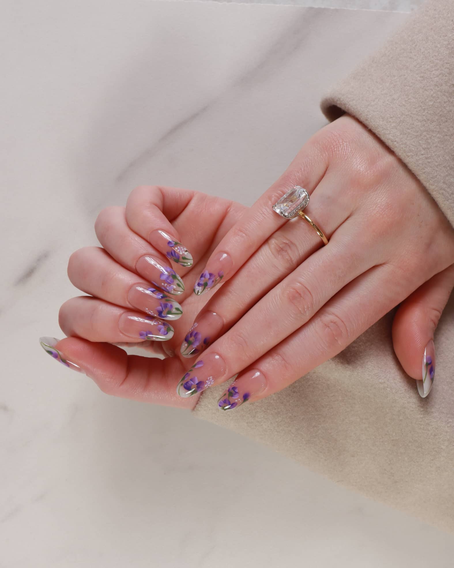 purple flowers nail extensions on hand