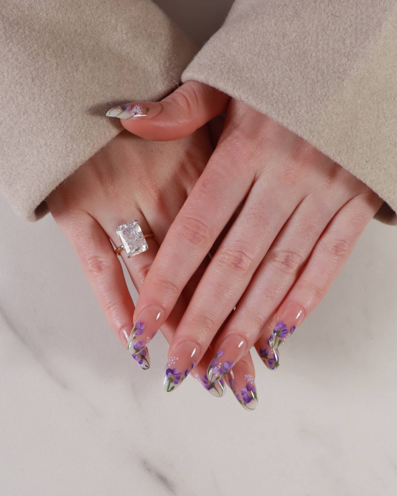 purple flowers nail extensions on hand