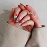 Close-up of hands with stylish nail art on a neutral background