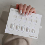 hand model displaying glittery nail designs.