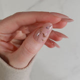 encapsulated dried flowers in thumbs