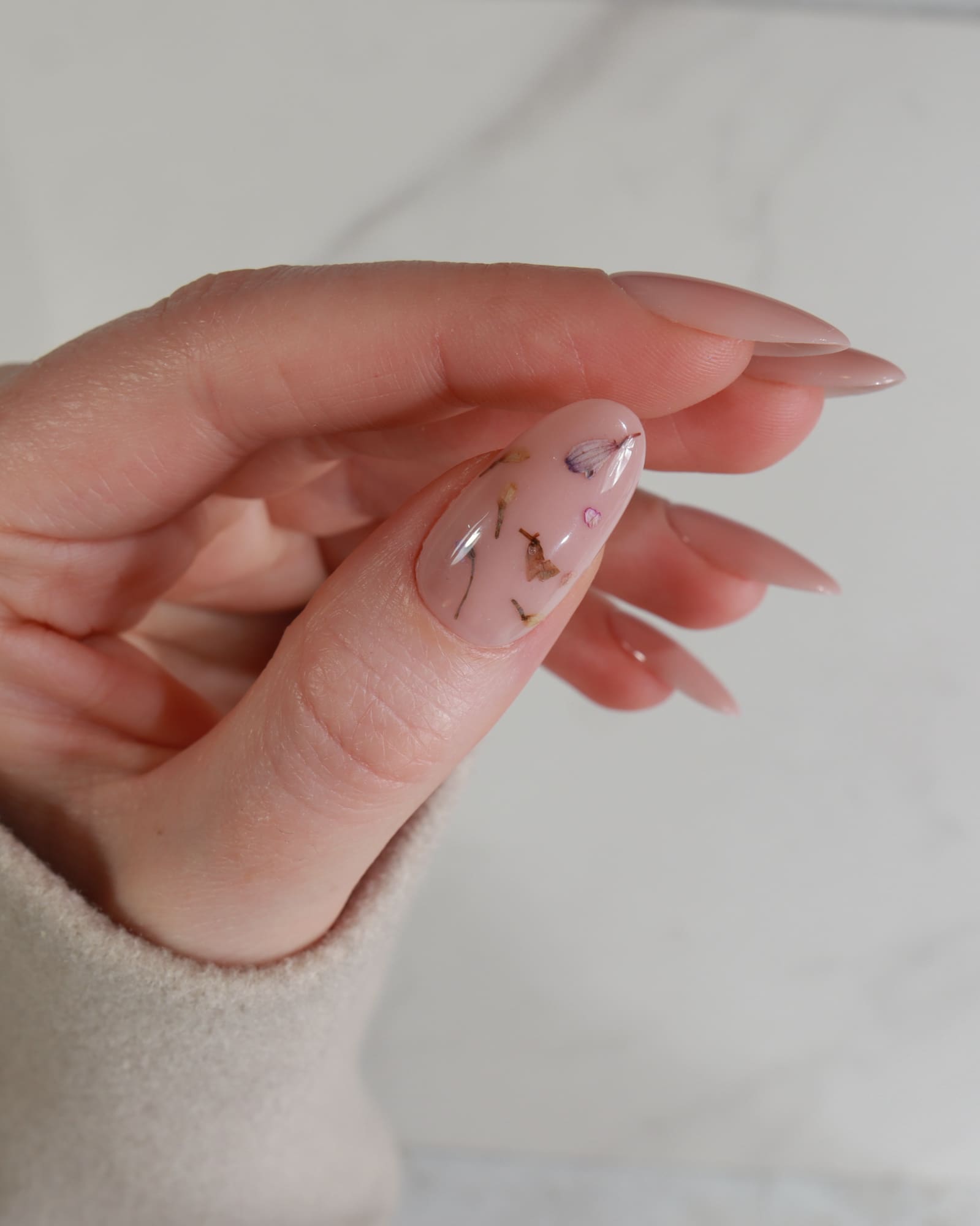 encapsulated dried flowers in thumbs