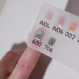 Color swatches in a white background  with a model hand