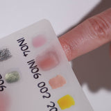 Color swatches in a white background  with a model hand