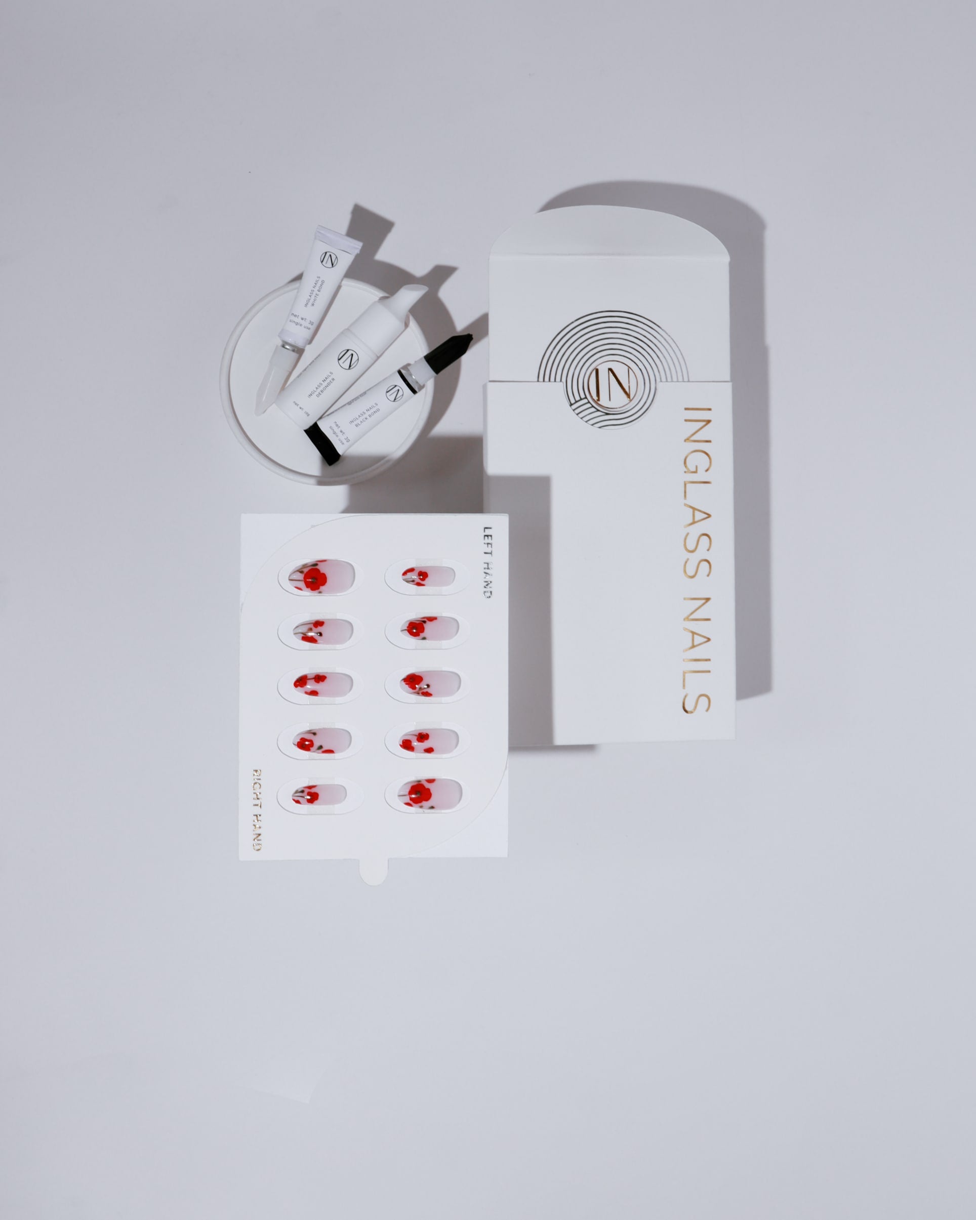 Inglass Nails product set on a light gray background