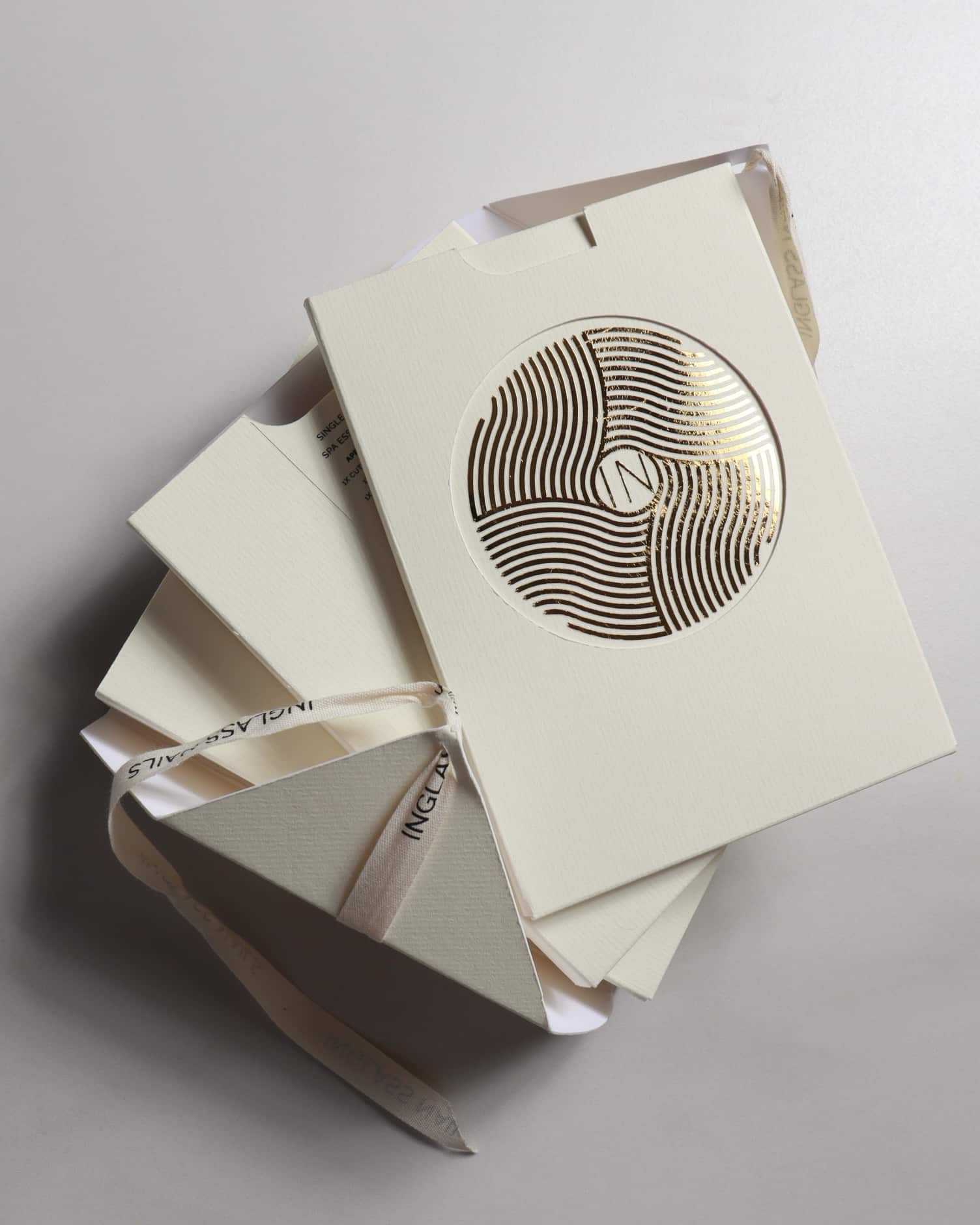 Stack of beige boxes by inglass nails decorative cutout on a light gray background lass 