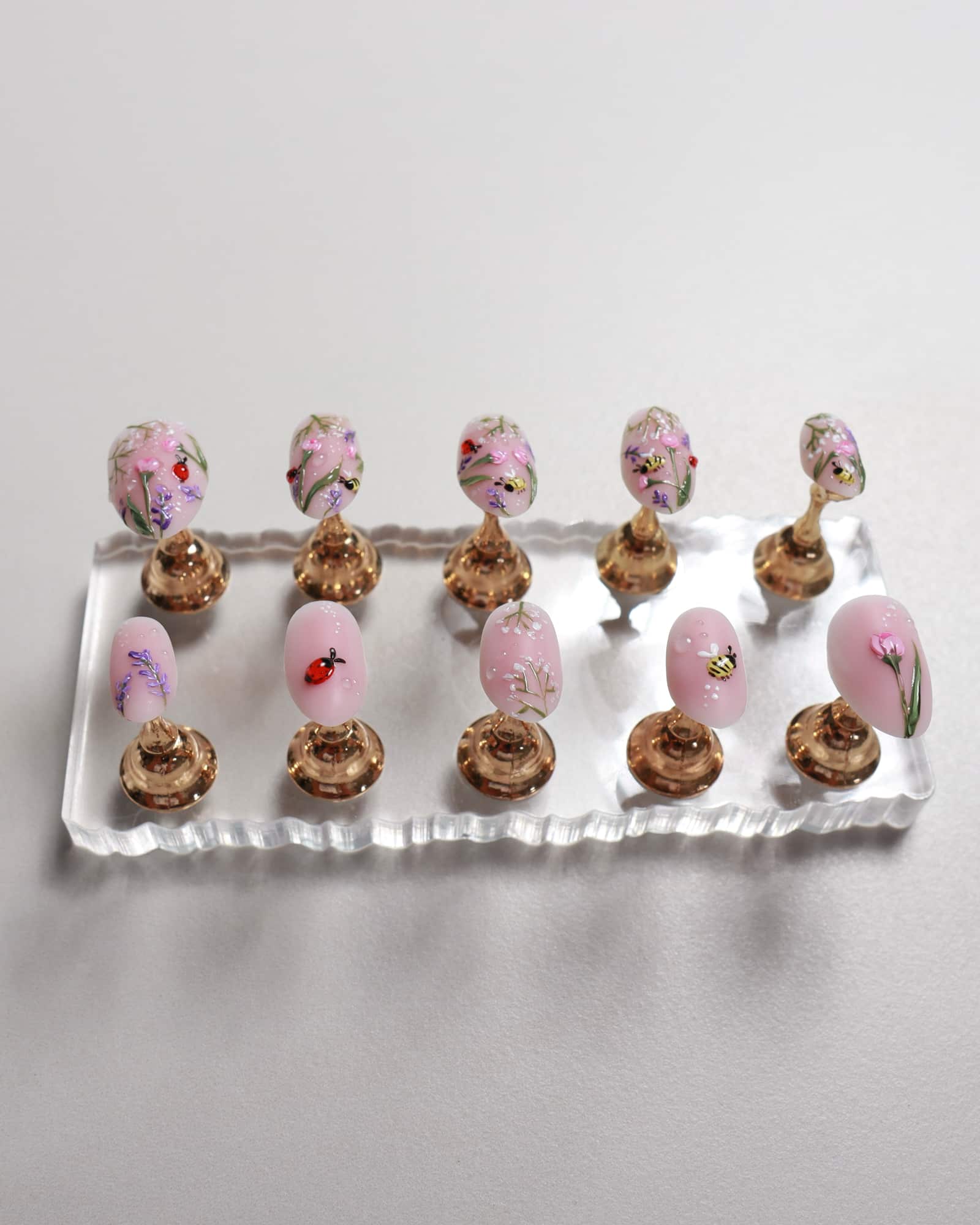 Nail set floral designs on a white tray