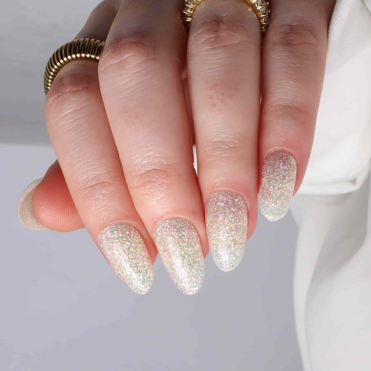 Glitter nails. Encapsulated glitter. Reusable nail extensions. 