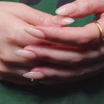 Reusable nail extensions in long almond length.