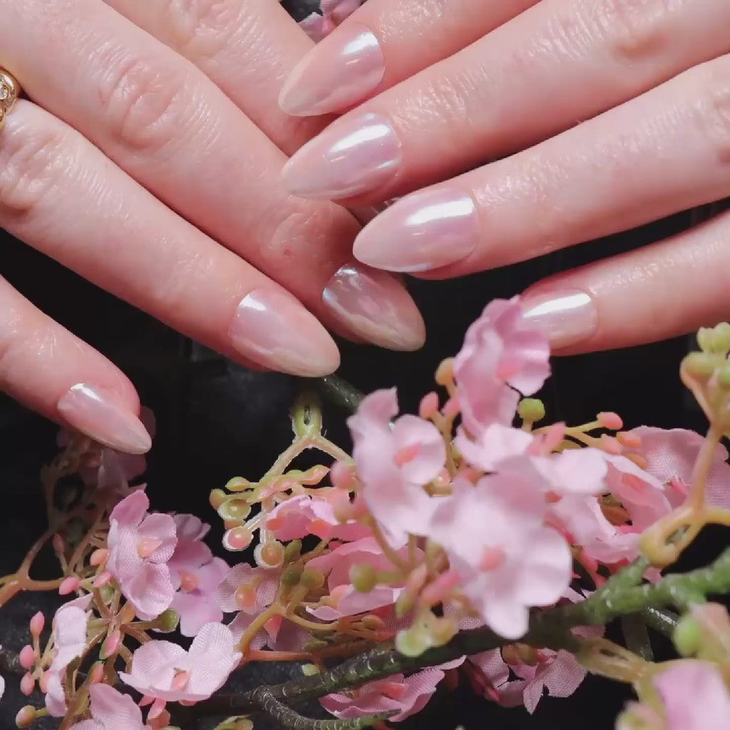 Reusable nail extensions in short almond length chrome nails. 